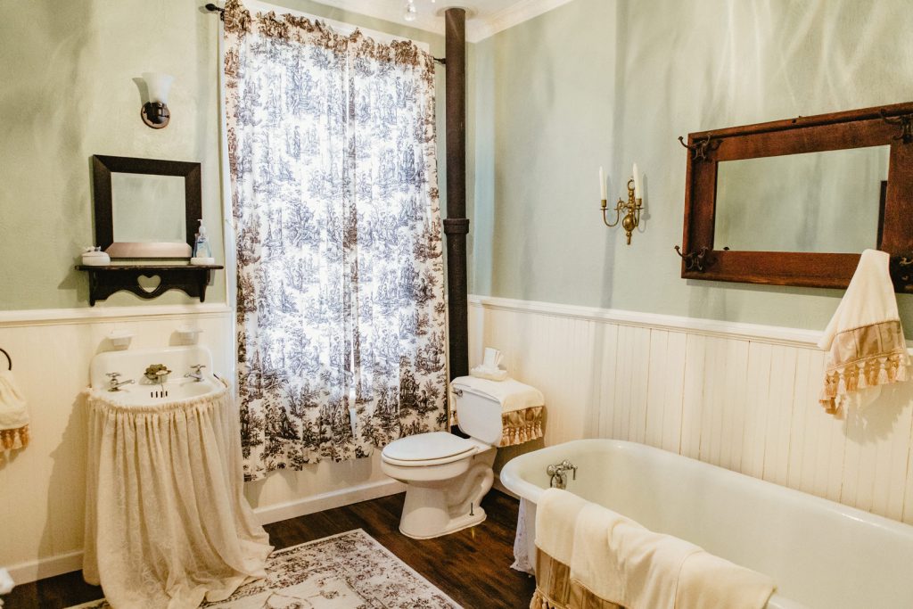 Freshen up in this bright, clean bathroom with a cast-iron claw foot tub.