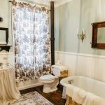 Freshen up in this bright, clean bathroom with a cast-iron claw foot tub.